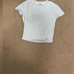 Hey! I am selling a medium girl checkered shirt!